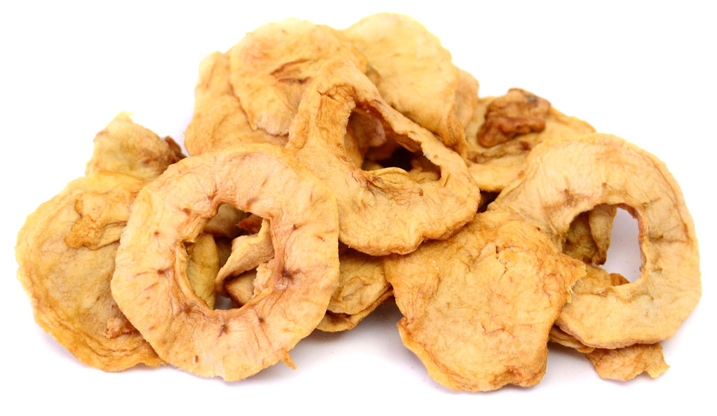 Free Photo | Bowl of dried apple rings on white surface